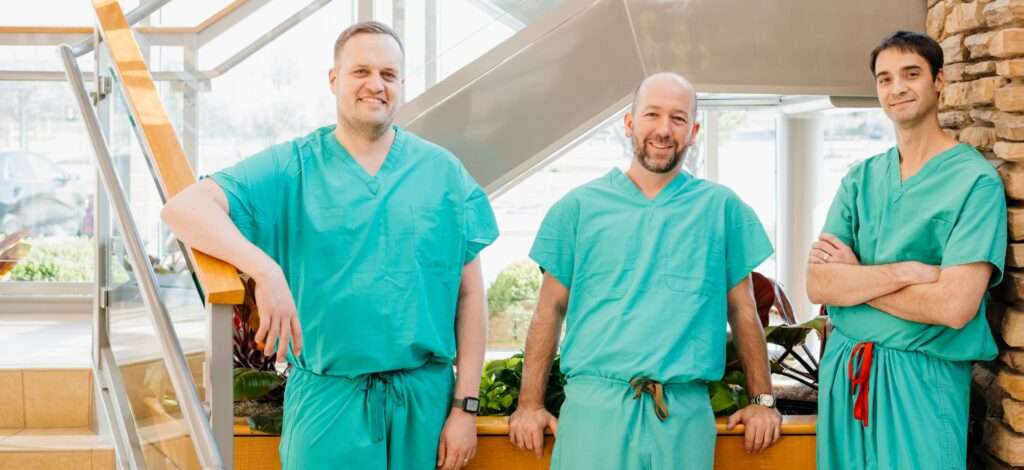 Doctors standing together smiling